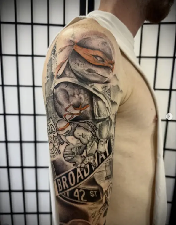 A half sleeve of cartoon turtles over a New York street scene, black and grey with orange bandanas.